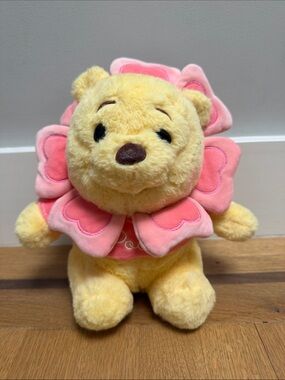 Winnie the Pooh dressed as a flower plush